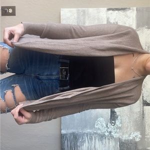 Small medium-beige cardigan. Barely worn.